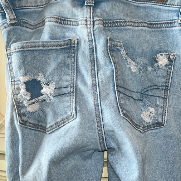 American Eagle jeans, size 0, light wash, patched rips, worn, good condition. - Picture 4 of 4